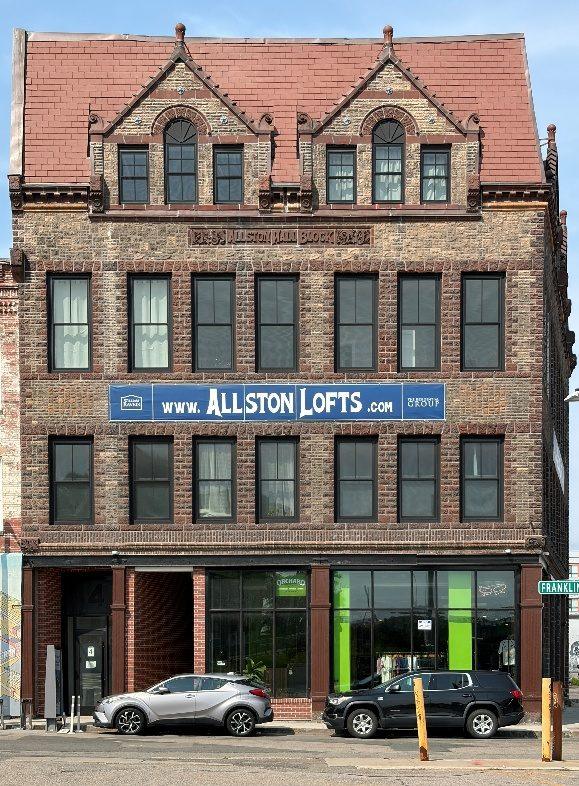 The Allston Lofts building with paired gables and arched windows